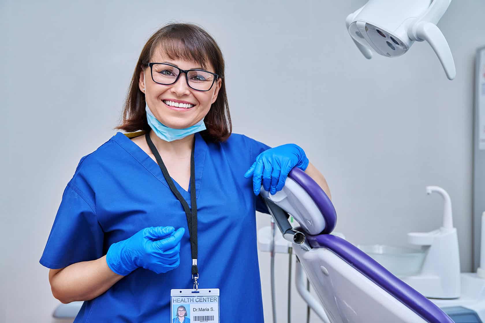 Portrait of smiling female doctor dentist in office